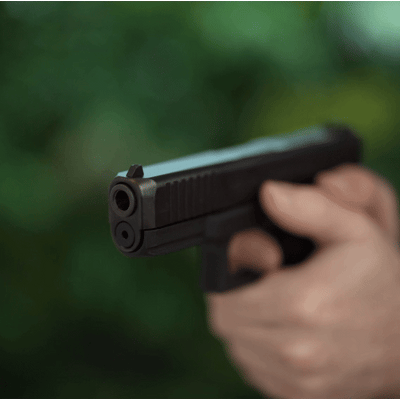 T-LASER activated by trigger pull, showing a red laser dot through the pistol barrel during dry-fire training