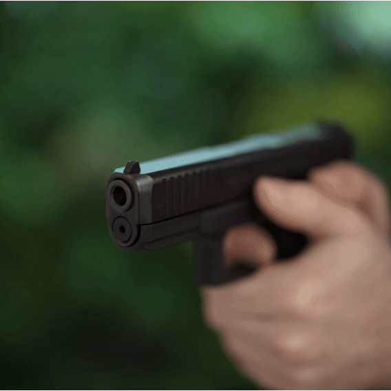 T-LASER activated by trigger pull, showing a red laser dot through the pistol barrel during dry-fire training